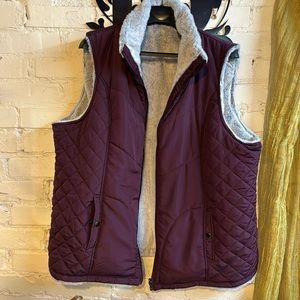 Cute soft faux fur vest that is warm and the color is wine or maroon